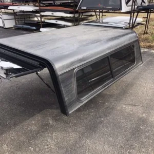 SOLD - USED LEER ALUM 13+ NISSAN KING CAB SHORT BED