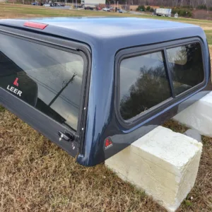 SOLD - USED TRADE IN LEER 100R TRUCK CAP 2013 NISSAN FRONTIER CREW CAB EXTRA SHORT BED GREY - 5132096 - SOLD